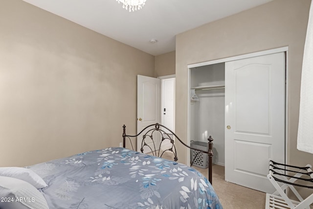 bedroom featuring light carpet and a closet