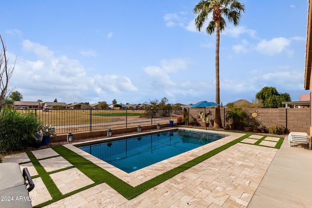 view of swimming pool featuring a patio