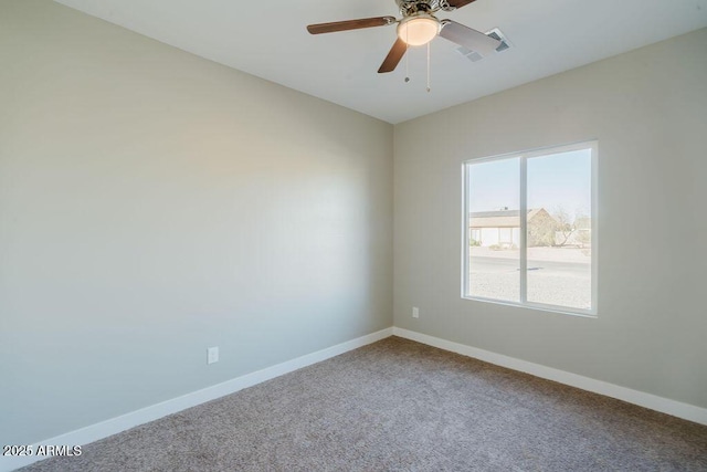 carpeted empty room featuring ceiling fan