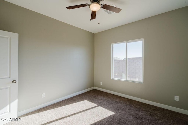 carpeted spare room with ceiling fan