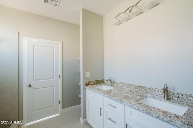 bathroom featuring vanity and tile patterned floors