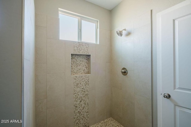 bathroom featuring tiled shower