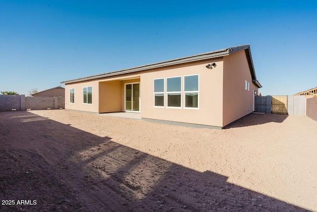 rear view of house with a patio