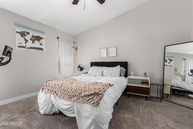 bedroom featuring lofted ceiling, dark colored carpet, and ceiling fan