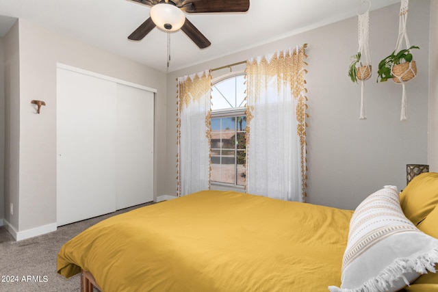 bedroom featuring a closet, ceiling fan, and carpet floors