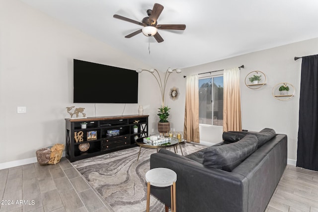 living room featuring light hardwood / wood-style floors and ceiling fan