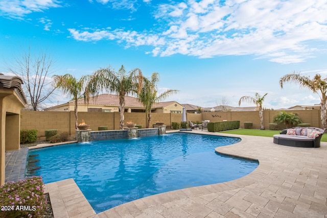 view of swimming pool with a patio area and pool water feature