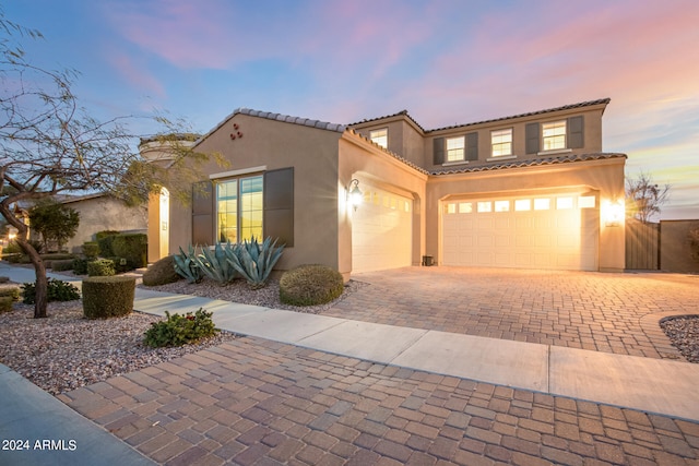 mediterranean / spanish-style house featuring a garage