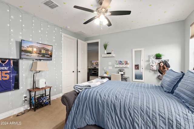 carpeted bedroom with ceiling fan