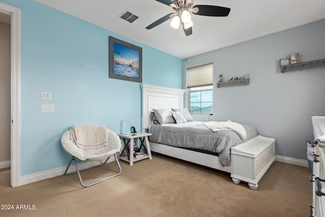 carpeted bedroom with ceiling fan