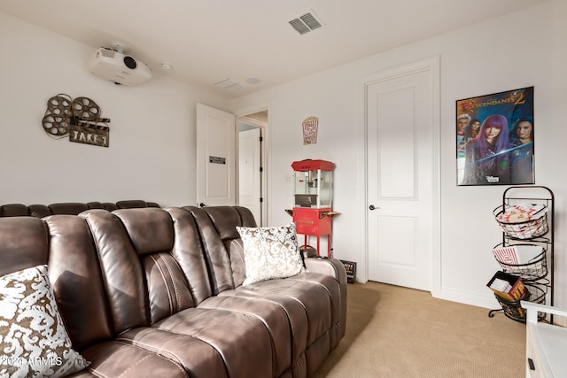 home theater room featuring light carpet