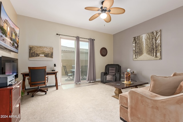 interior space with ceiling fan and light colored carpet