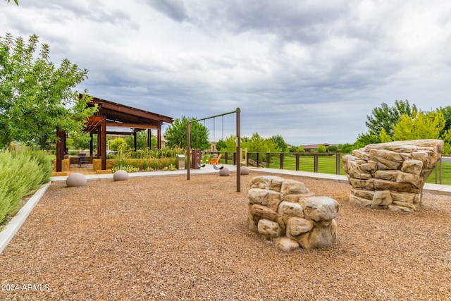 exterior space featuring a gazebo and a playground