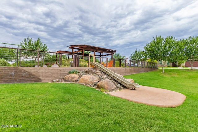 view of playground with a yard