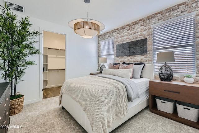 3129 S 155th Ln, Goodyear, AZ 85338 - bedroom with carpet floors, a spacious closet, brick wall, and a closet