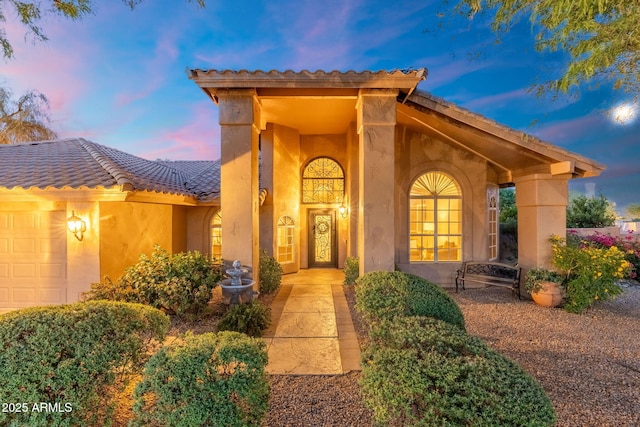 19275 N 88th Way, Scottsdale, AZ 85255 - view of front of house featuring a garage, a tiled roof, and stucco siding