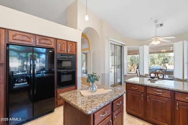 19275 N 88th Way, Scottsdale, AZ 85255 - kitchen featuring black appliances, light stone countertops, light tile patterned floors, and a ceiling fan