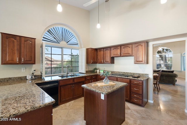 19275 N 88th Way, Scottsdale, AZ 85255 - kitchen featuring black appliances, a towering ceiling, light stone countertops, pendant lighting, and a ceiling fan