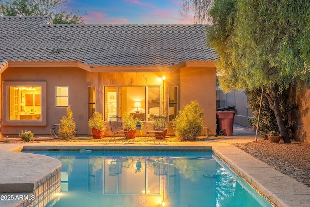19275 N 88th Way, Scottsdale, AZ 85255 - back of house at dusk with a tiled roof and stucco siding
