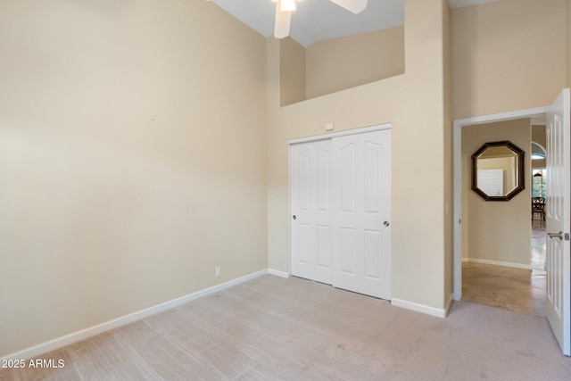 19275 N 88th Way, Scottsdale, AZ 85255 - unfurnished bedroom featuring high vaulted ceiling, light carpet, and a closet