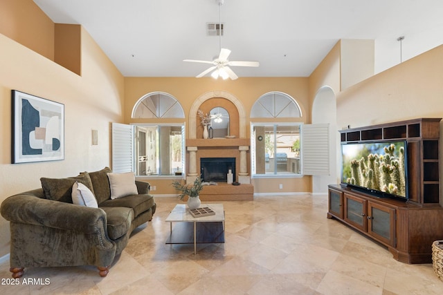 19275 N 88th Way, Scottsdale, AZ 85255 - living area with a ceiling fan, a high ceiling, and a fireplace with raised hearth