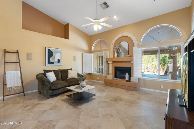 19275 N 88th Way, Scottsdale, AZ 85255 - living room with a ceiling fan, high vaulted ceiling, and a fireplace with raised hearth