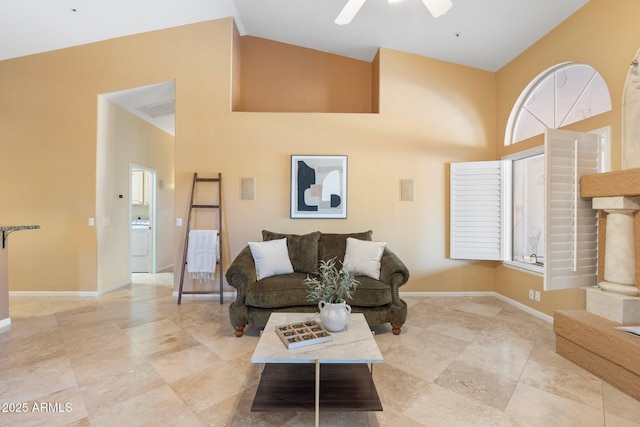 19275 N 88th Way, Scottsdale, AZ 85255 - living area with a high ceiling, ceiling fan, and washer / clothes dryer