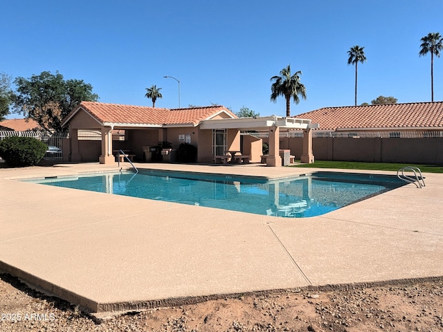 view of swimming pool featuring a patio area, a fenced in pool, and fence