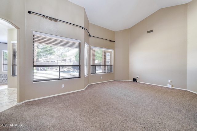 1470 W Bartlett Way, Chandler, AZ 85248 - unfurnished room with carpet flooring, lofted ceiling, arched walkways, and baseboards