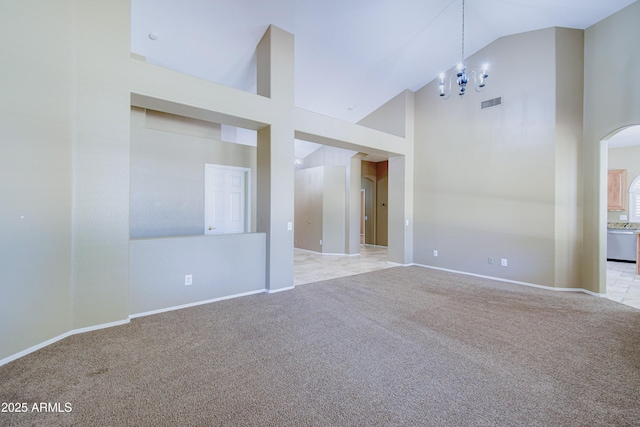 1470 W Bartlett Way, Chandler, AZ 85248 - empty room featuring high vaulted ceiling, light carpet, arched walkways, and baseboards