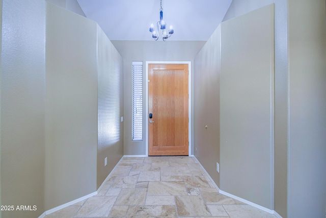 1470 W Bartlett Way, Chandler, AZ 85248 - doorway to outside with light stone finish flooring, baseboards, and a chandelier