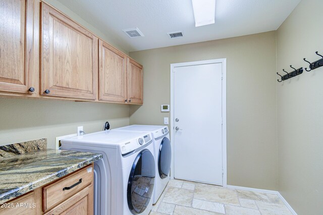 1470 W Bartlett Way, Chandler, AZ 85248 - washroom with cabinet space, washer and clothes dryer, baseboards, and light stone finish floors