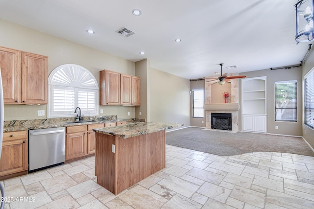 1470 W Bartlett Way, Chandler, AZ 85248 - kitchen with stainless steel dishwasher, ceiling fan, a center island, a sink, and healthy amount of natural light