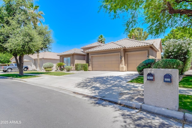 1470 W Bartlett Way, Chandler, AZ 85248 - view of front of property with stucco siding, driveway, and a tiled roof