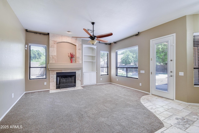 1470 W Bartlett Way, Chandler, AZ 85248 - unfurnished living room with a fireplace, built in shelves, ceiling fan, and baseboards