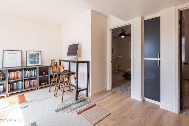 office featuring baseboards and wood finished floors