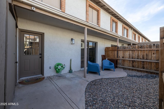 view of patio / terrace featuring fence