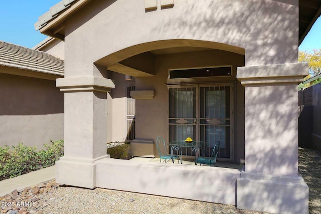 doorway to property with stucco siding