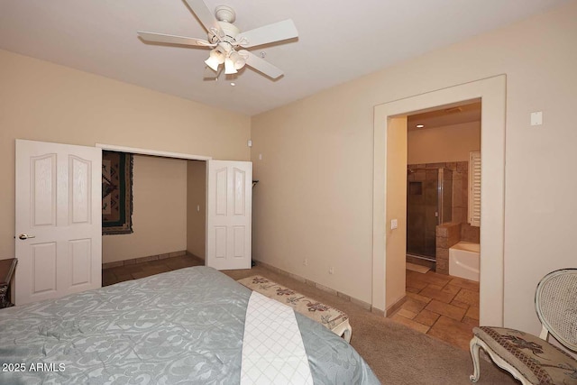 bedroom featuring ceiling fan, carpet, ensuite bathroom, and baseboards