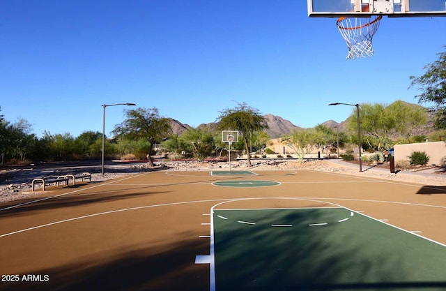 view of basketball court featuring community basketball court and a mountain view