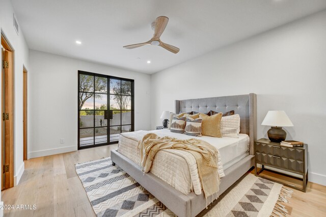 bedroom featuring ceiling fan, access to outside, and light hardwood / wood-style floors