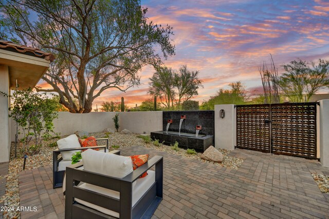 patio terrace at dusk with outdoor lounge area