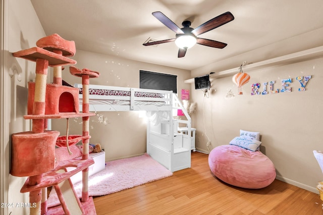 bedroom featuring hardwood / wood-style flooring and ceiling fan