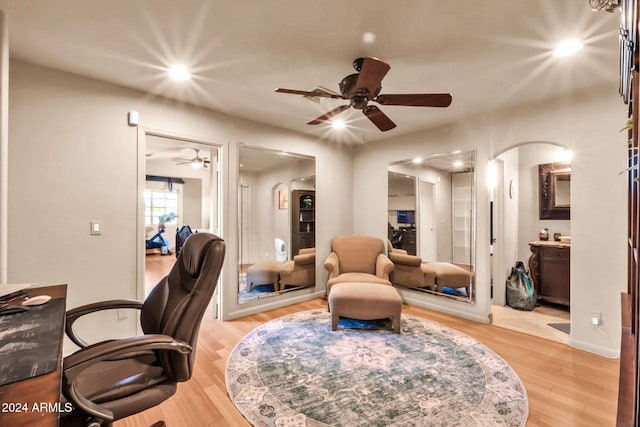 office with ceiling fan and light wood-type flooring