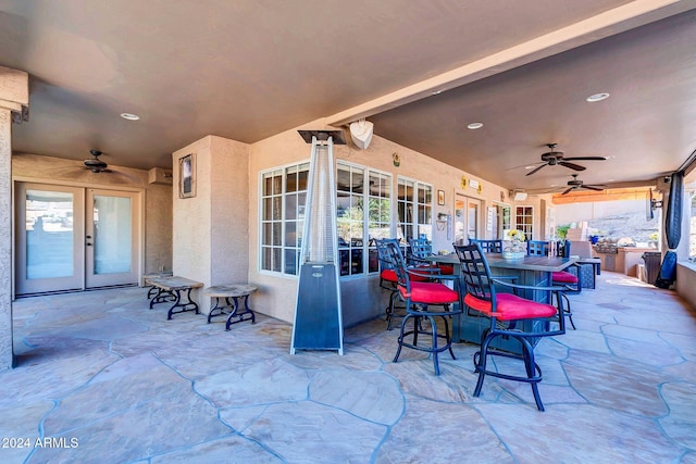 view of patio with french doors and ceiling fan