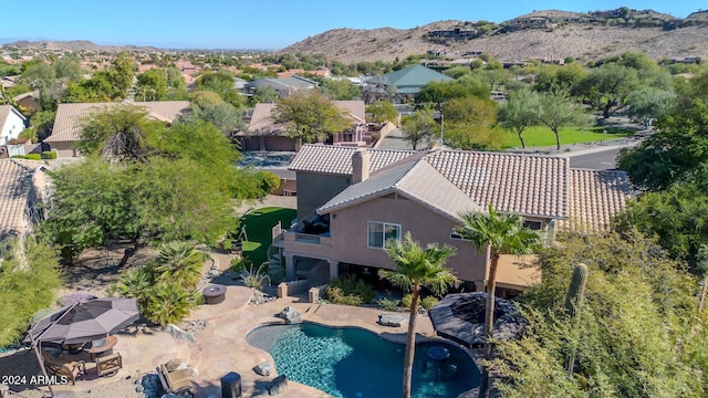 birds eye view of property featuring a mountain view