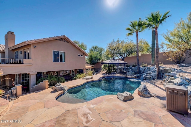 view of swimming pool featuring a patio and pool water feature