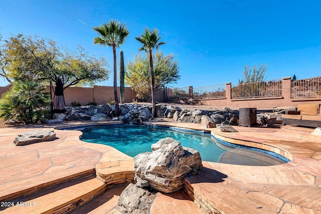 view of pool featuring a patio