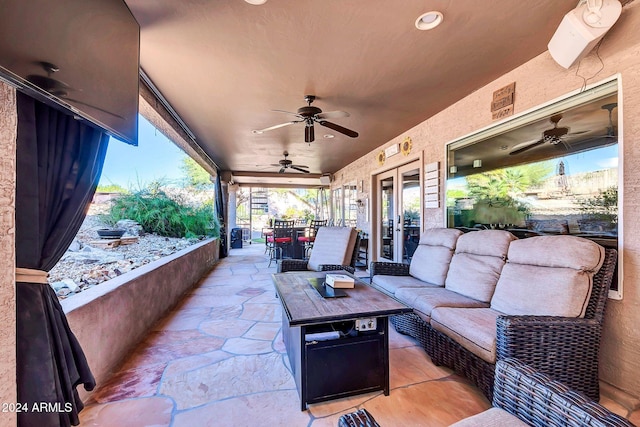 view of patio / terrace with french doors, ceiling fan, and an outdoor hangout area