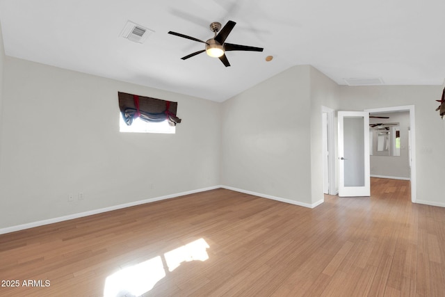 spare room with lofted ceiling, light hardwood / wood-style flooring, and ceiling fan